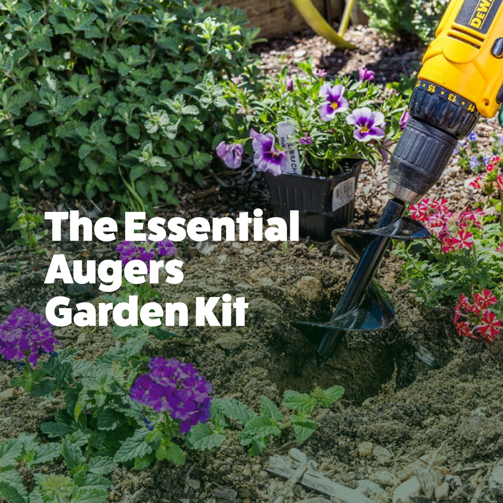 Garden auger being used to dig a hole in soil with flowers and plants around.